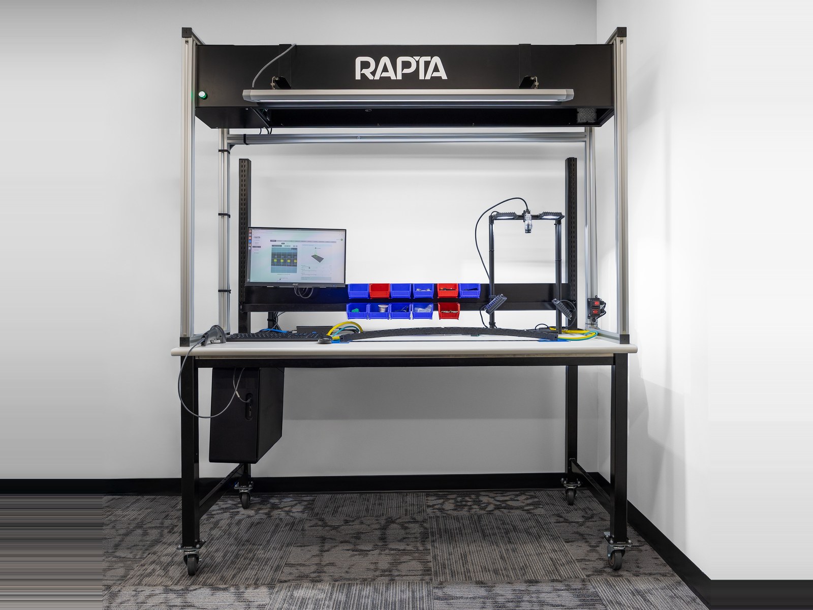 Rapta Superpod work cell with an overhead camera and lighting hood that verifies each assembly step