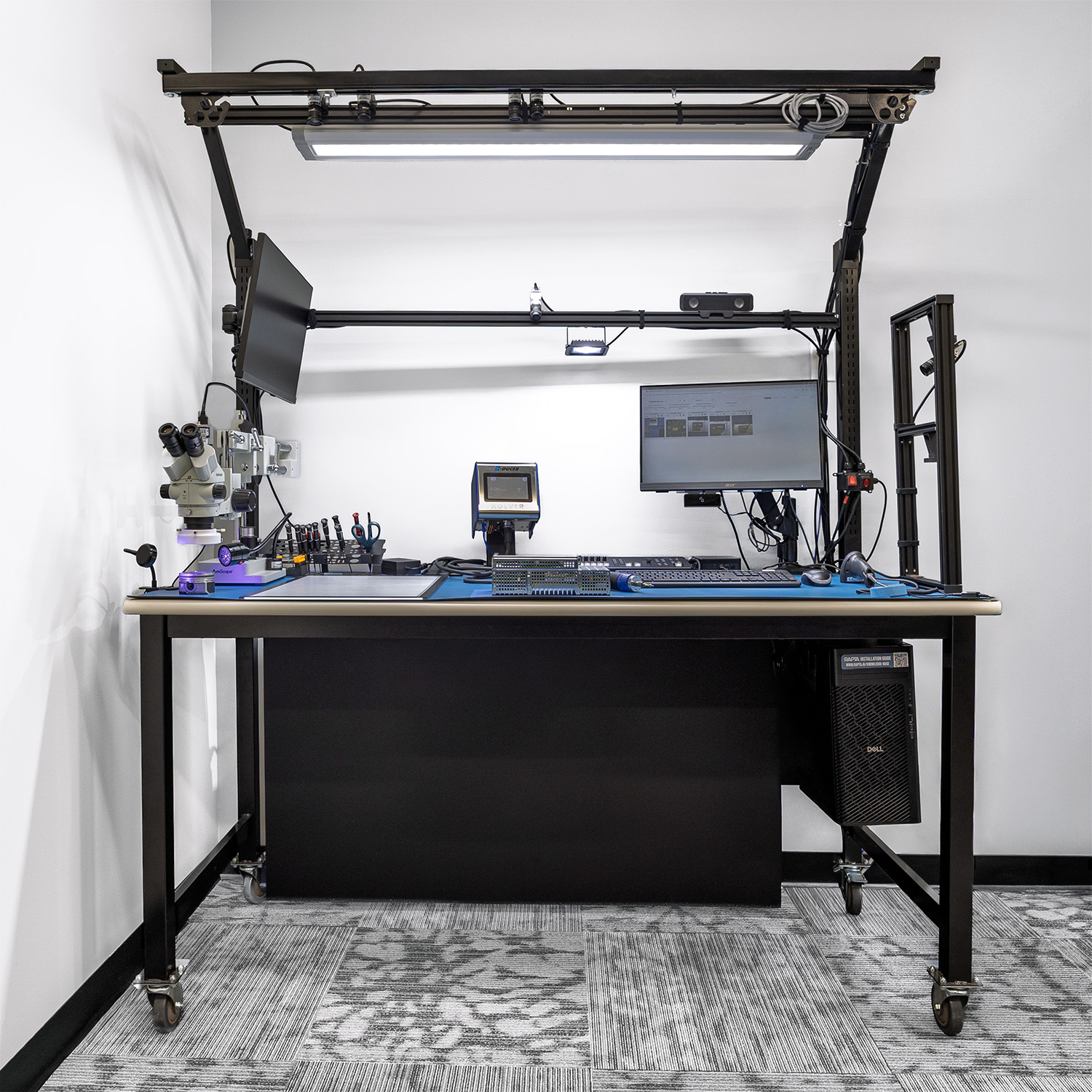 Rapta Fixed Array multi-camera work cell with a connected torque controller and inspection microscope